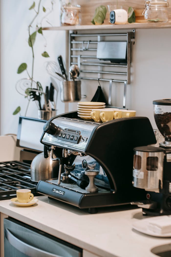 pexels-photo-5825347 Espresso machine with cups in cozy kitchen setting.